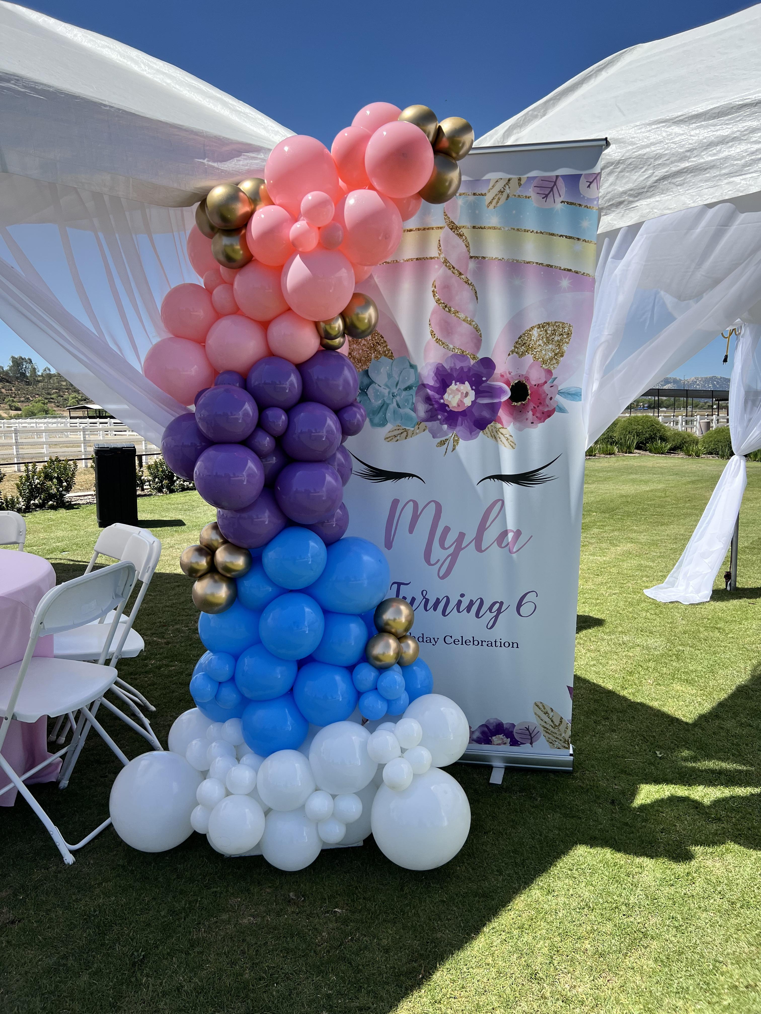 Large white, blue, purple, and pink ballon garland