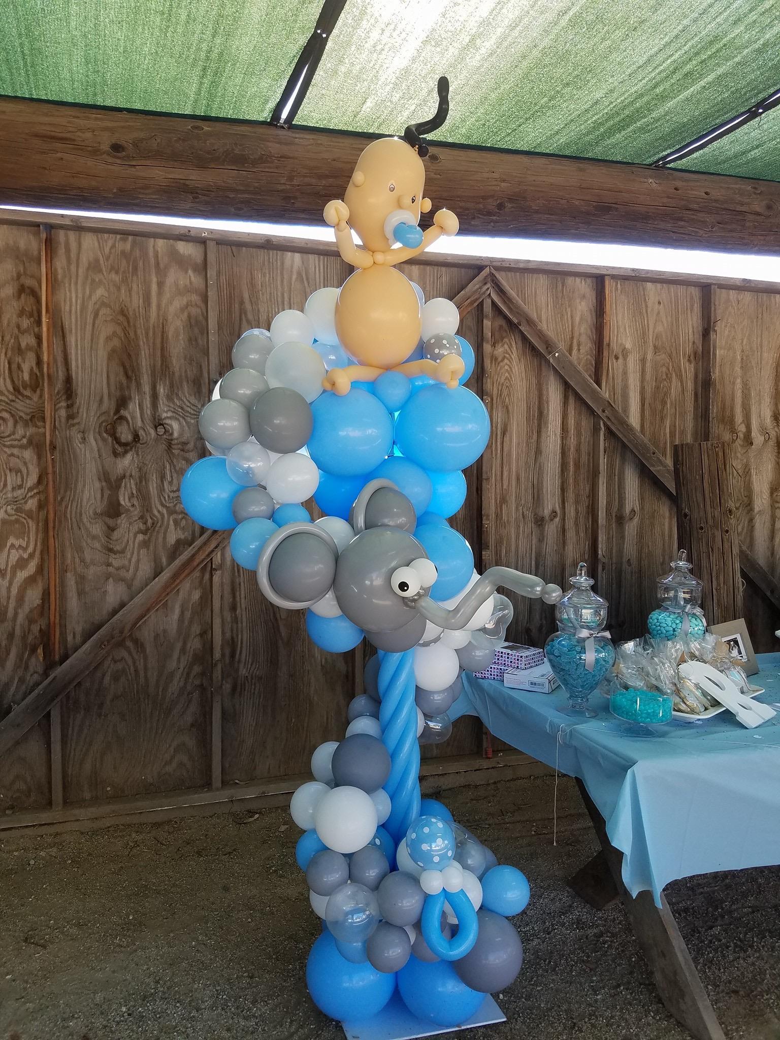 Baby themed balloon column for a baby shower